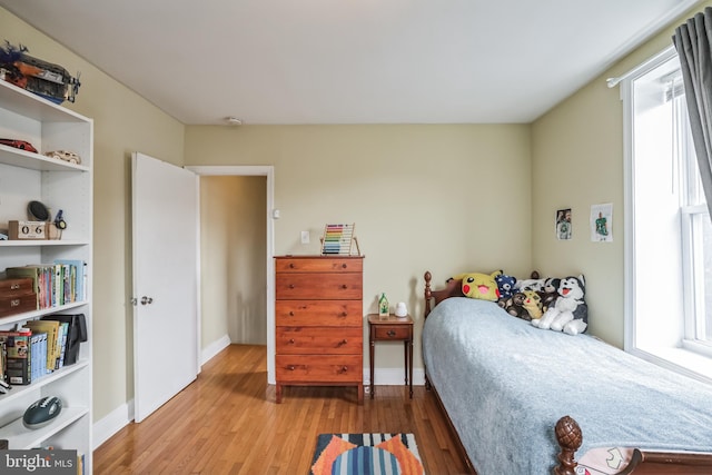 bedroom with light hardwood / wood-style floors