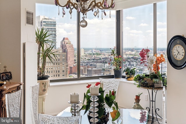 dining room featuring an inviting chandelier and a healthy amount of sunlight