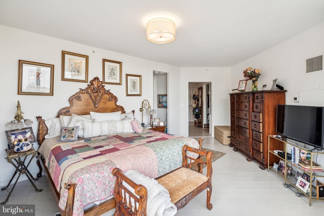 bedroom with a spacious closet and a closet