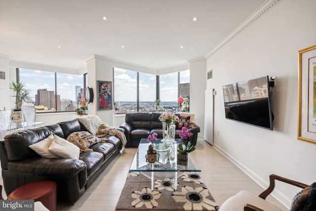 living room with light hardwood / wood-style flooring, floor to ceiling windows, and crown molding