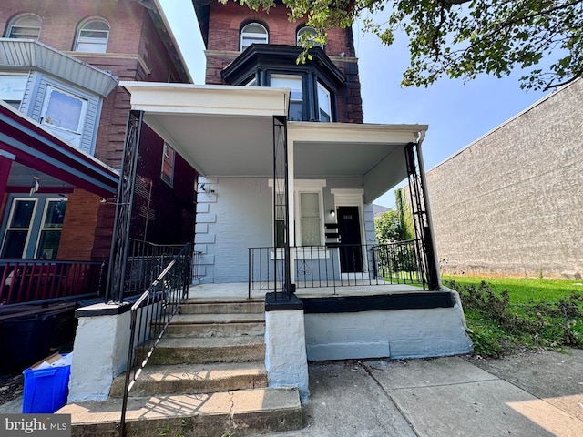 entrance to property with covered porch