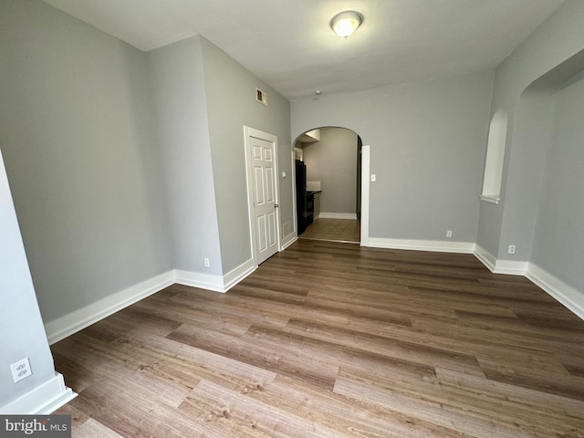 unfurnished room featuring hardwood / wood-style floors