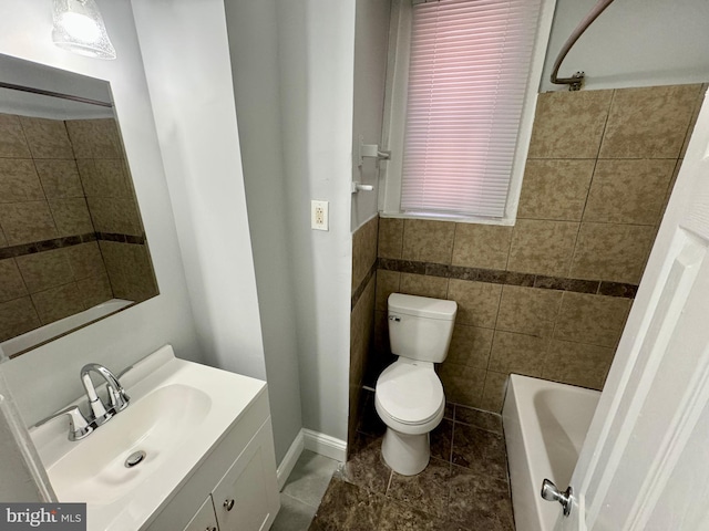 full bathroom featuring tile patterned floors, vanity, tile walls, toilet, and tiled shower / bath