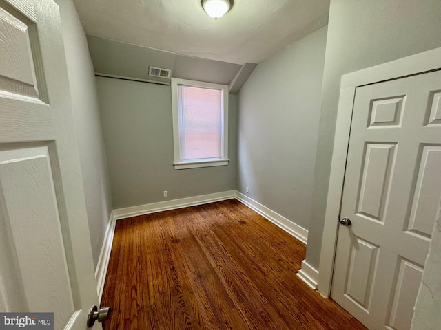 unfurnished bedroom featuring dark hardwood / wood-style flooring