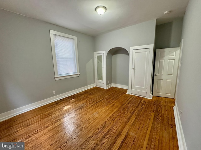 unfurnished bedroom featuring hardwood / wood-style floors