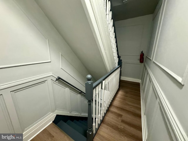 staircase featuring hardwood / wood-style flooring