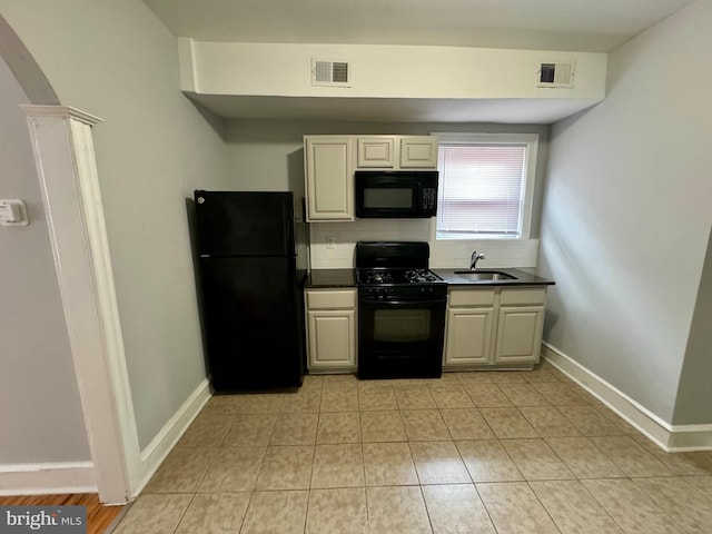 kitchen featuring sink and black appliances