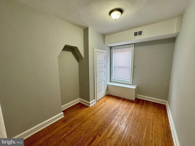 unfurnished bedroom featuring hardwood / wood-style floors