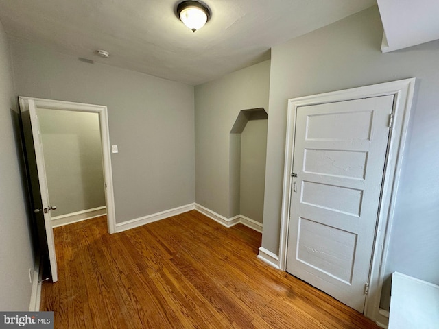 spare room featuring hardwood / wood-style flooring