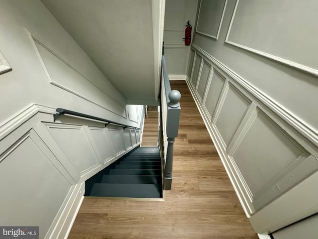 stairway featuring wood-type flooring