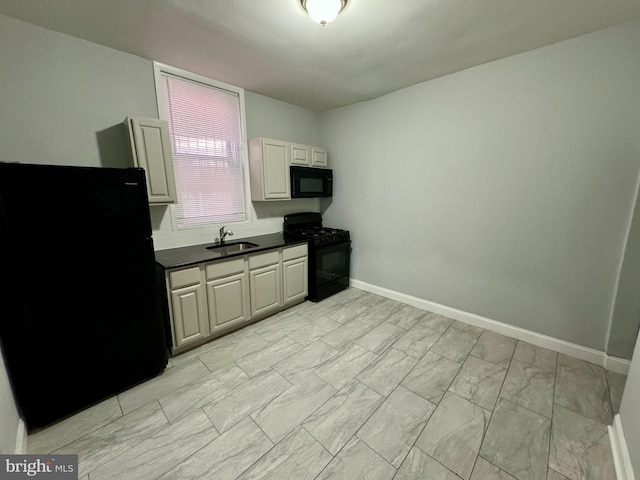 kitchen with sink and black appliances