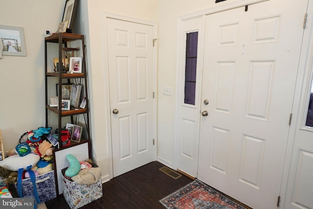 entryway featuring dark wood-type flooring