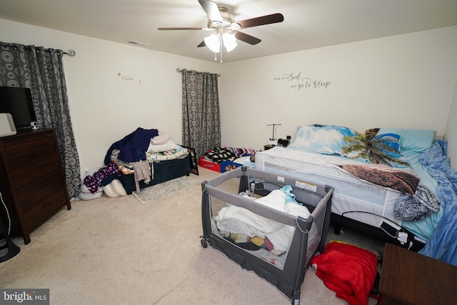 carpeted bedroom featuring ceiling fan