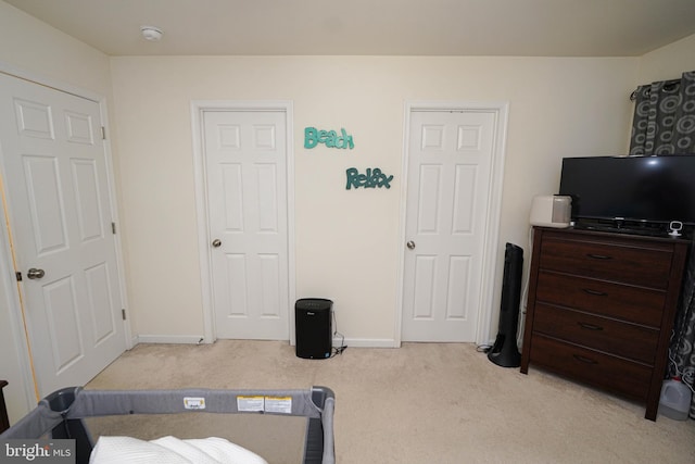 bedroom with light carpet