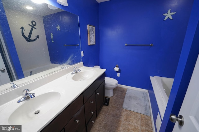 bathroom featuring tile patterned flooring, vanity, and toilet