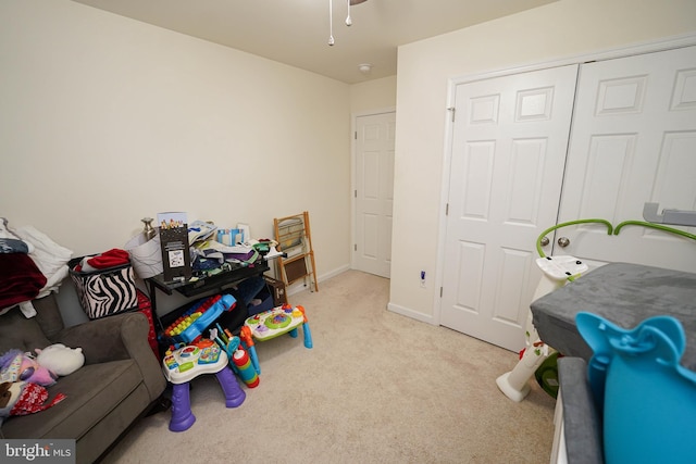 playroom featuring ceiling fan and light colored carpet