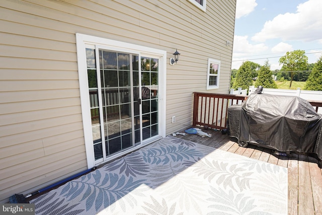 wooden deck with grilling area