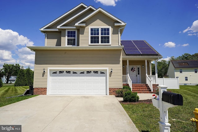 view of front of house with a garage, covered porch, a front lawn, and solar panels