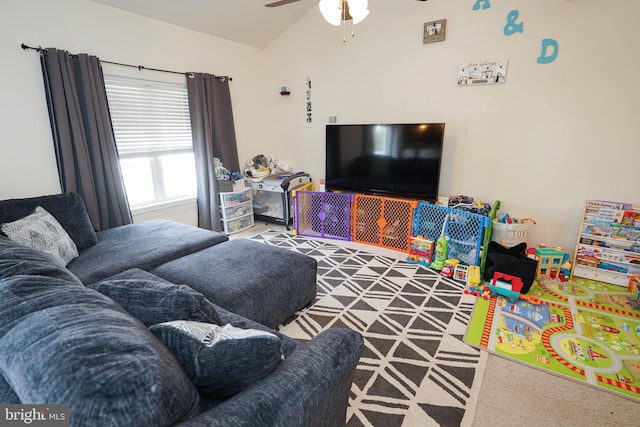 living room with ceiling fan and carpet