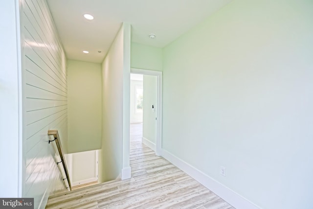 corridor with light hardwood / wood-style flooring