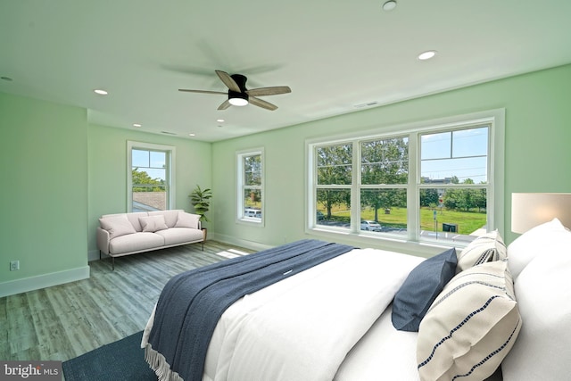 bedroom featuring ceiling fan and light wood-type flooring