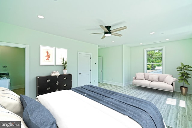 bedroom with hardwood / wood-style flooring and ceiling fan