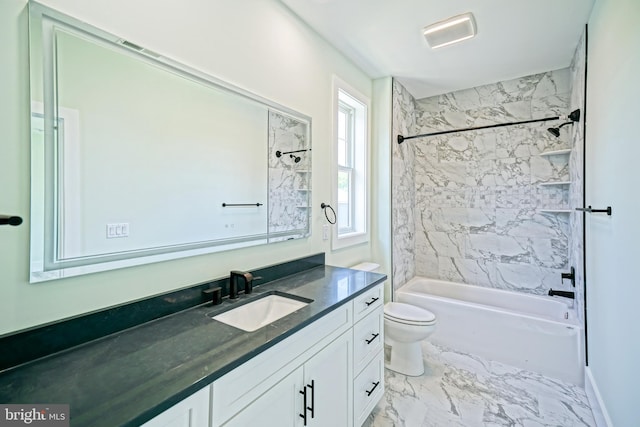 full bathroom featuring vanity, toilet, and tiled shower / bath