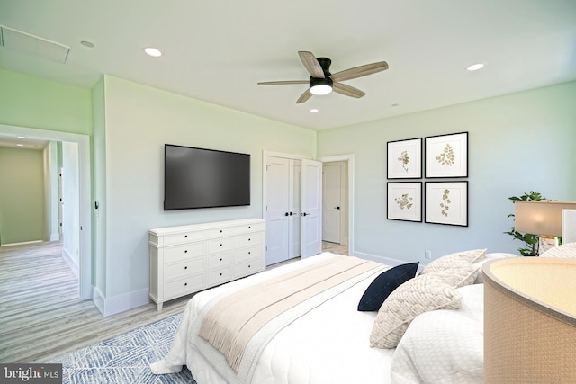 bedroom featuring ceiling fan and light hardwood / wood-style floors