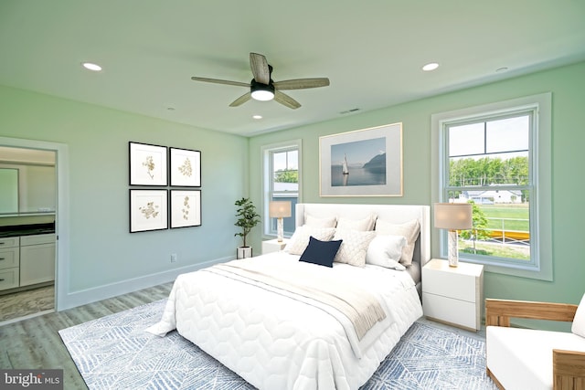 bedroom with ceiling fan and light wood-type flooring