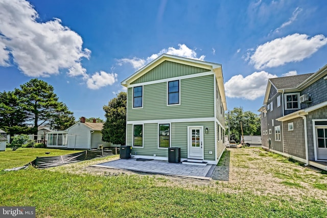 back of house with a yard, a patio, and cooling unit