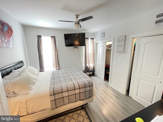 bedroom with ceiling fan and light hardwood / wood-style flooring