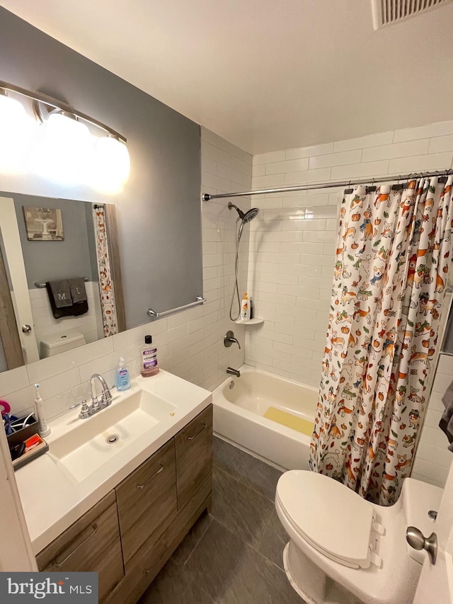 full bathroom with tile patterned floors, toilet, decorative backsplash, shower / bath combo with shower curtain, and vanity