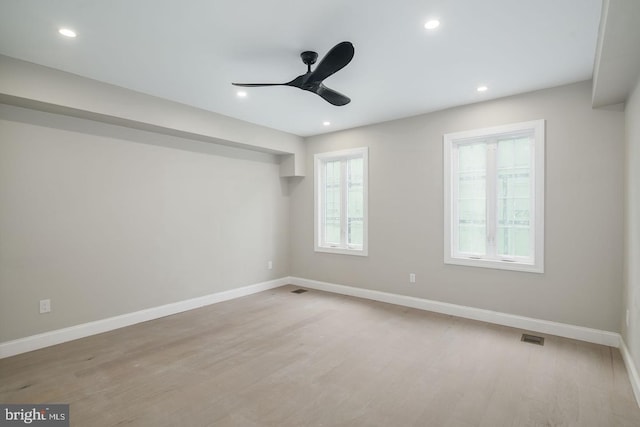 spare room with ceiling fan and light hardwood / wood-style floors