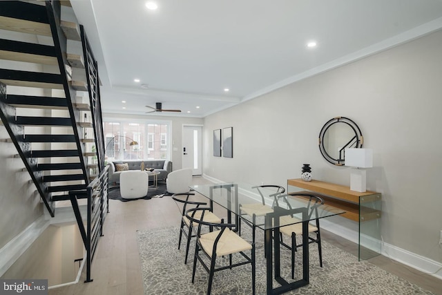 dining room featuring light hardwood / wood-style flooring and ceiling fan