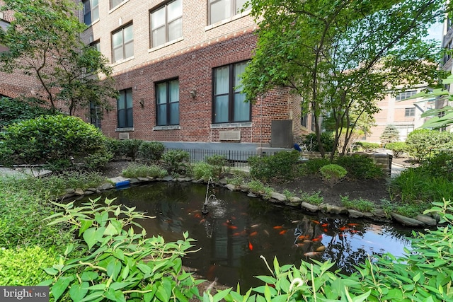 exterior space featuring a small pond