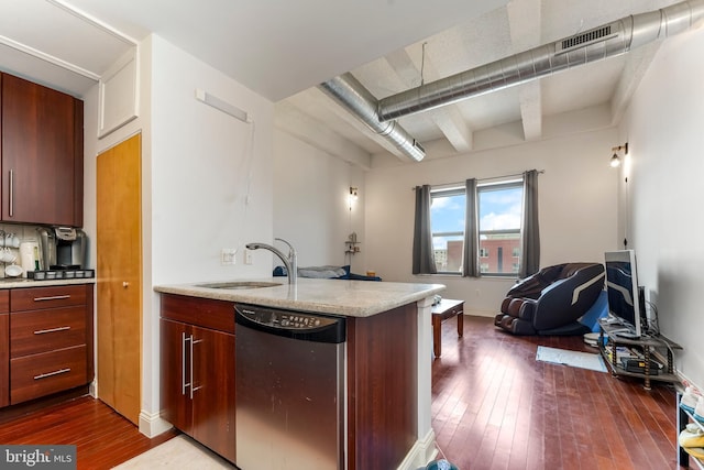 kitchen featuring sink, stainless steel dishwasher, and dark hardwood / wood-style floors