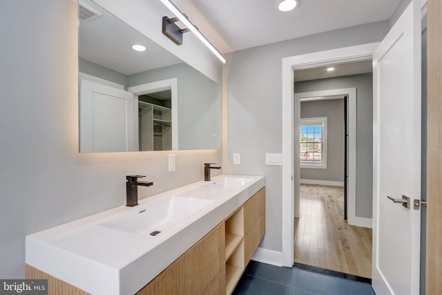 bathroom with vanity and hardwood / wood-style flooring