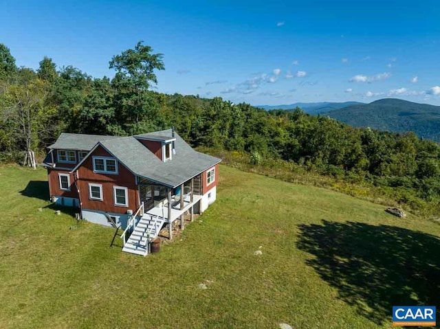 drone / aerial view featuring a mountain view