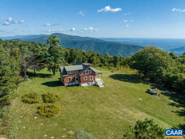 birds eye view of property with a mountain view