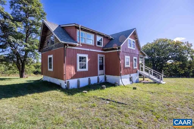 view of side of home featuring a lawn