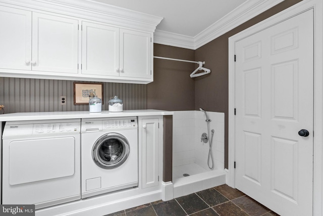 laundry room featuring washer and dryer and ornamental molding