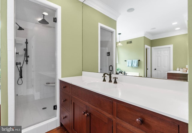 bathroom with vanity, ornamental molding, and walk in shower