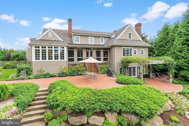 rear view of house featuring a patio