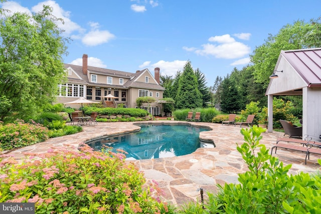 view of pool with a patio