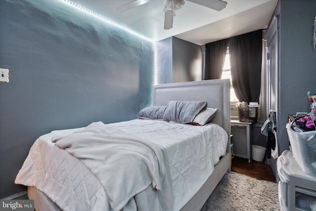 bedroom featuring wood-type flooring and ceiling fan