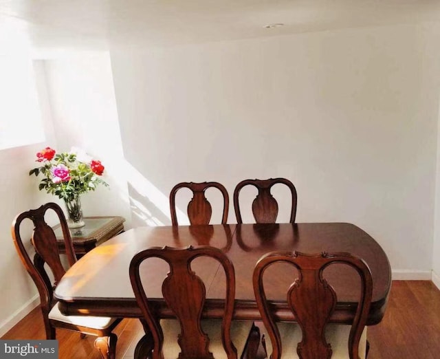 dining space featuring hardwood / wood-style flooring