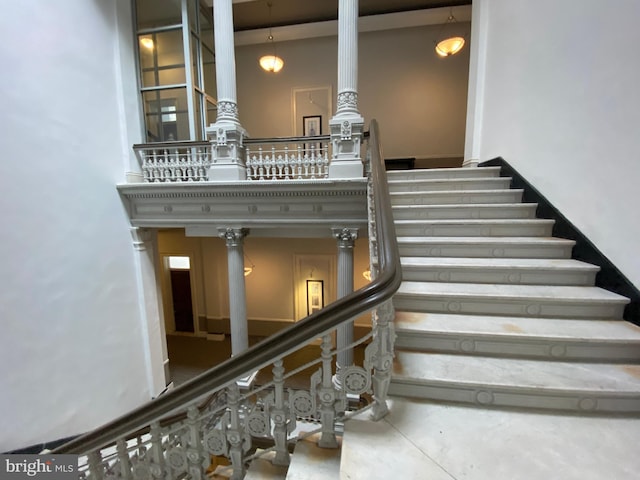 stairs featuring concrete floors