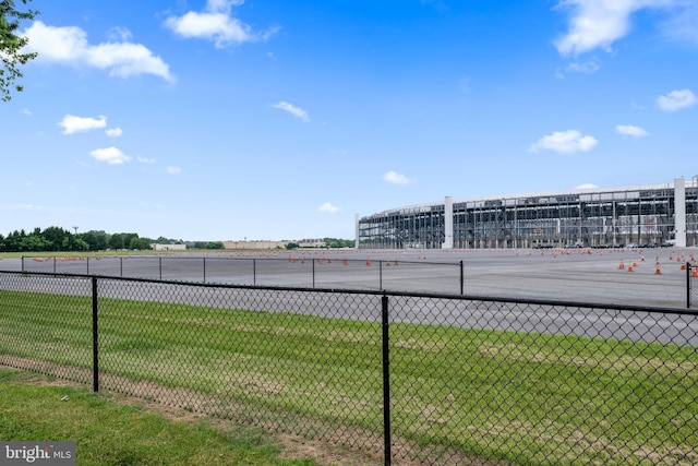 view of vehicle parking featuring a lawn