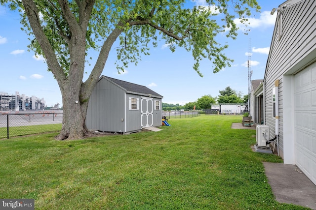 view of yard with ac unit and a shed