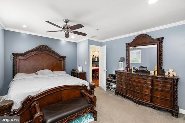 carpeted bedroom with ceiling fan and crown molding